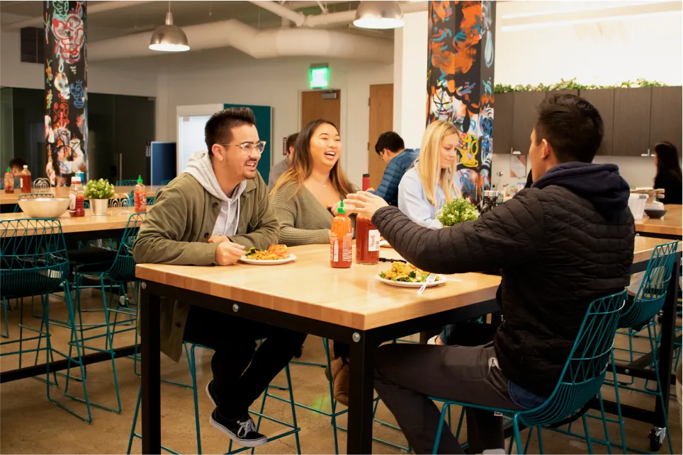 A group of people enjoying a meal in a restaurant. 